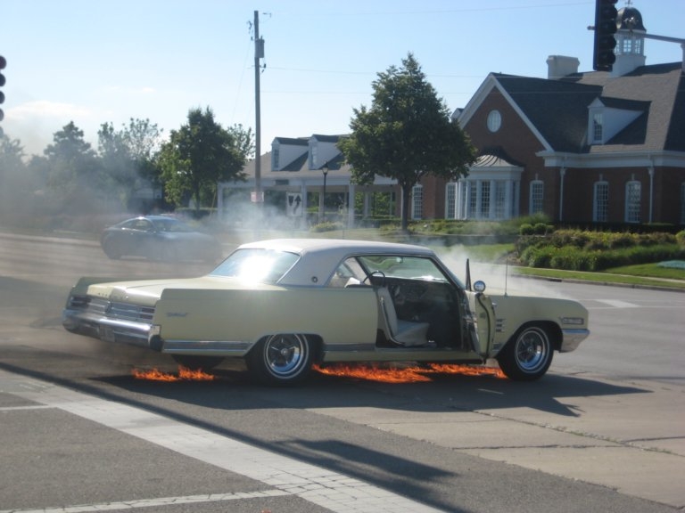 1964 Wildcat on fire in intersection
